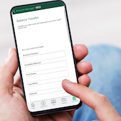 Person making balance transfer on mobile device