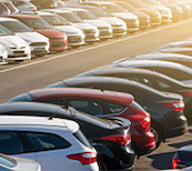 Cars lined up in a parking lot