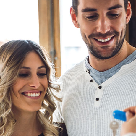 Happy couple getting house keys