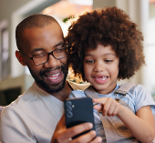 father and son using phone
