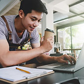 A young man on his laptop