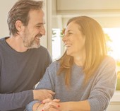 Smiling couple looking at each other