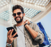 A young man looking at his phone.