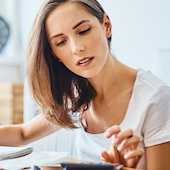 Woman using calculator