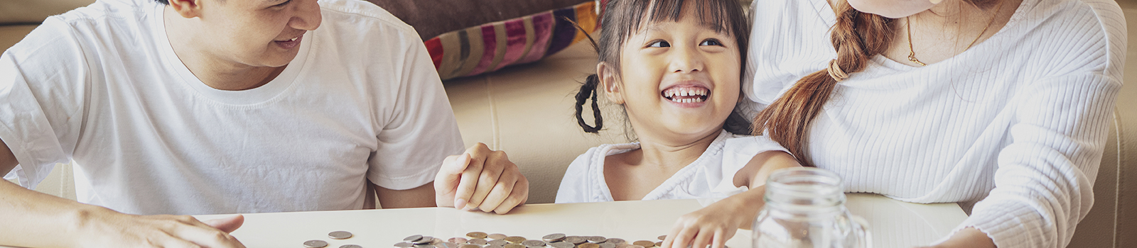 Little girl smiling with family.