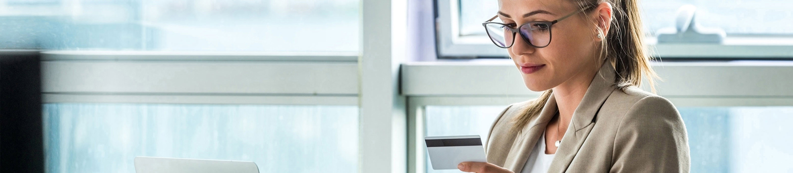 Woman looking down at her Visa Gift Card.