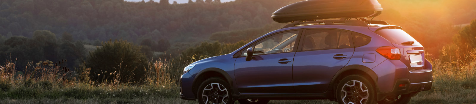 A car overlooking a sunset.