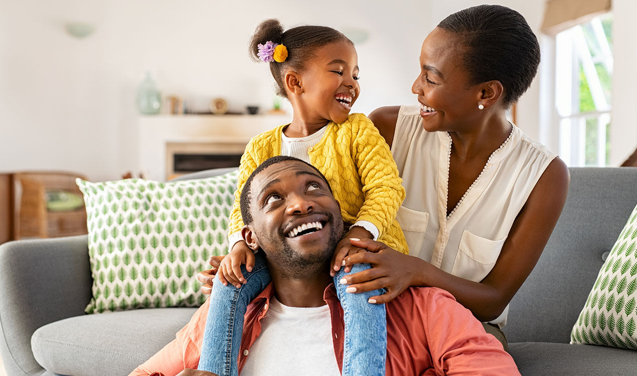 family sitting in living room