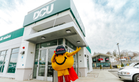 "Smiley Ball, the iconic yellow mascot of Worcester, happily waving in front of the DCU branch entrance on Gold Star Blvd., visiting all three Worcester locations during March Member Appreciation Days.