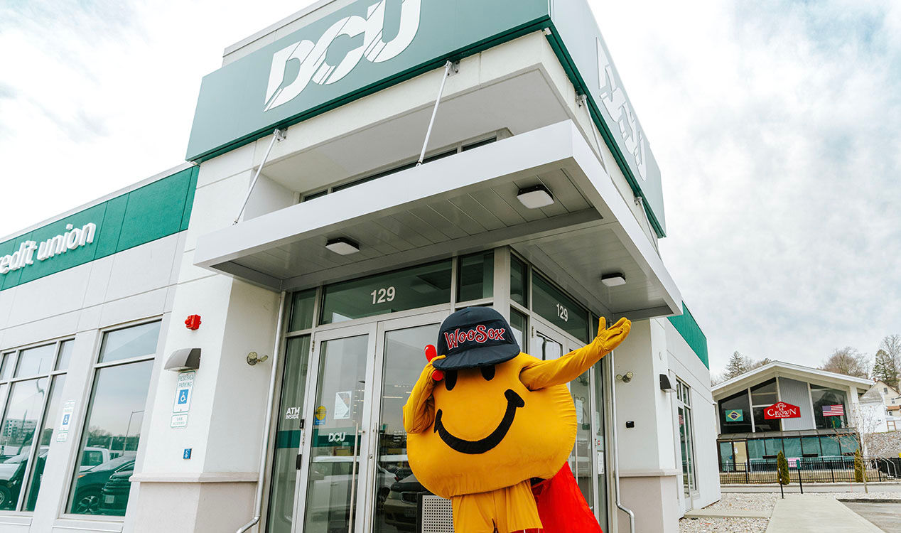 Smiley Ball, the iconic yellow mascot of Worcester, happily waving in front of the DCU branch entrance on Gold Star Blvd., visiting all three Worcester locations during March Member Appreciation Days.