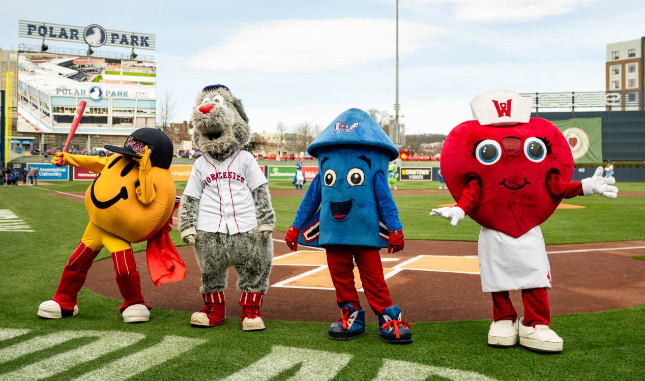 Worcester Red Sox mascots waive to the home crowd at a 2025 game at Polar Park in Worcester, Mass.
