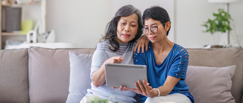 Woman looking at a tablet.