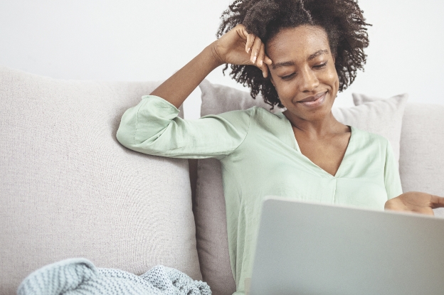 Woman logging in to Digital Banking on a laptop
