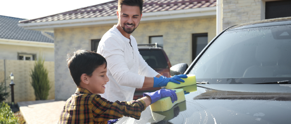 son and father with car