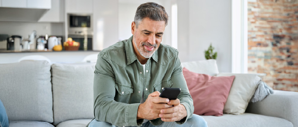 Man using mobile device.